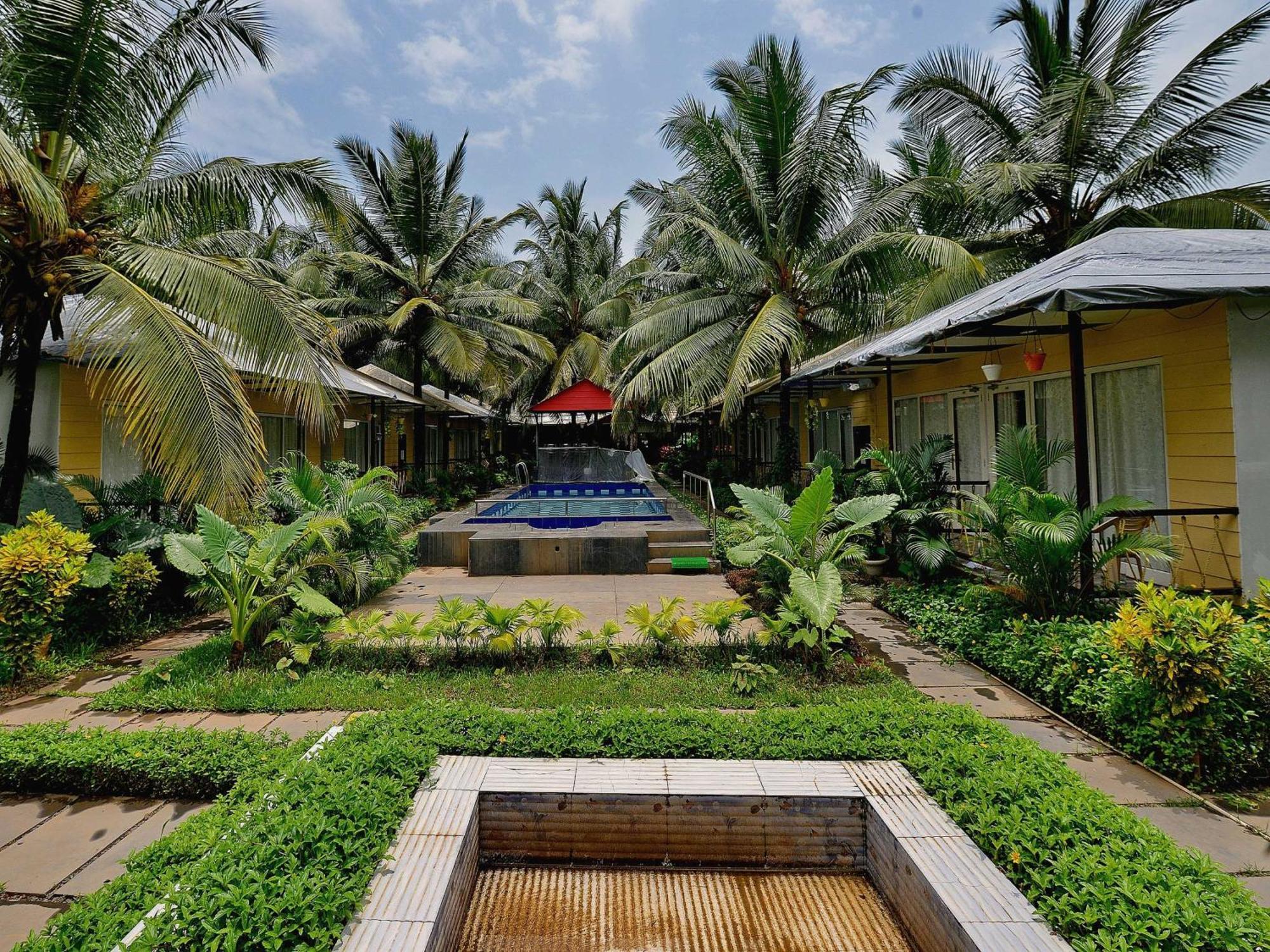 Collection O Retreat Morjim Resort Buitenkant foto